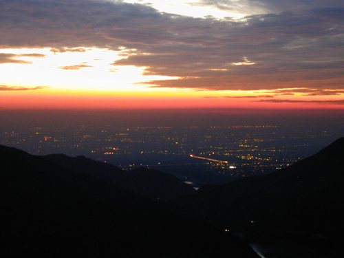 Looking down from Gldendora Mountain Road at the mouth of San Gabriel Canyon with the lights of the Los Angeles Basin 