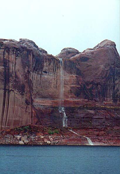 Waterfalls surrounded us pouring down off the cliffs in Escalante River Canyon after the heavy rainfall
