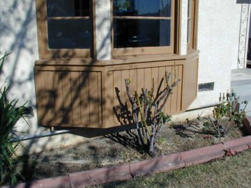 exterior trim painted and siding and trim replaced at bay window